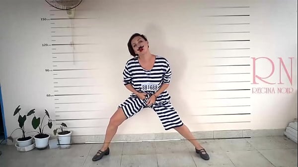 Photographing In Prison. The Detained Woman Is A Prisoner Of The Prison. She Is Made To Peel On Camera. Cosplay. 1
