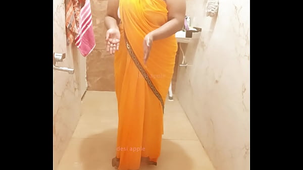 Indian Cleaner Bathing In Saree