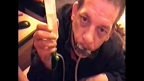 Bisexual Male Sitting On Edge Of Bed Drinks His Own Piss Three Times Threw A Private Pissing Device