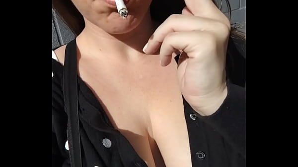 Kelly Kendricks Smokes Cigarettes In The Sun With Lots Of Cleavage