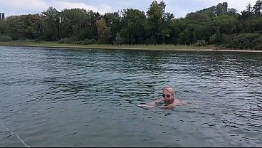 Tempting Granny Swims Bare In A Lake!