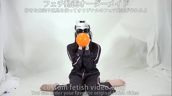 A Doll Inflates And Splits A Balloon