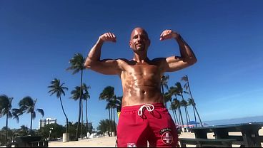 BICEP FLEXING AT THE BEACH