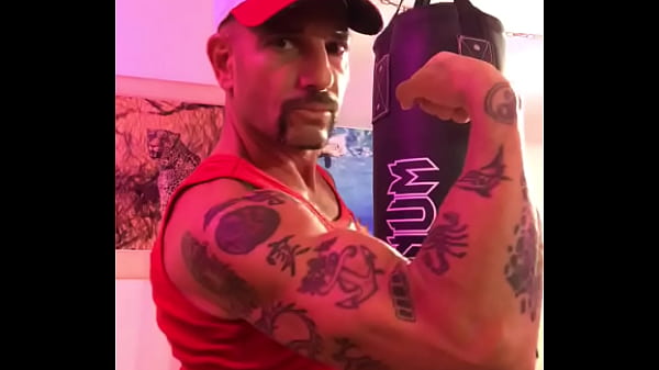 BICEP FLEXING STRONG ARM WITH TATTOOS