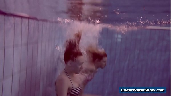 Frisky Chicks Undress Eachother In The Pool