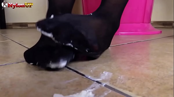 Brown-haired In Pantyhose Presents Feet Play To A Cream Tube