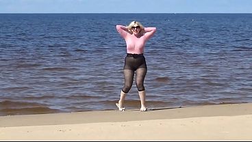 Funny Hotwife With Nylon Rear And Rack On Beach