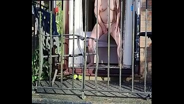 Nasty Doll Jerking In Full View On The Balcony