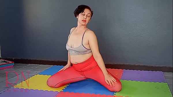 Regina Noir. A Babe In Yoga Leotards Practices Yoga In The Gym. Transparent Red Leotard Yoga. 1
