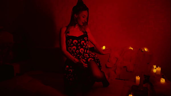 Naked Divine Witch Between Firing Candles
