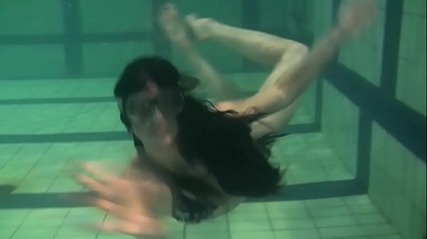 Chestnut-haired Coed Kristina Andreeva Swims Exposed In The Pool