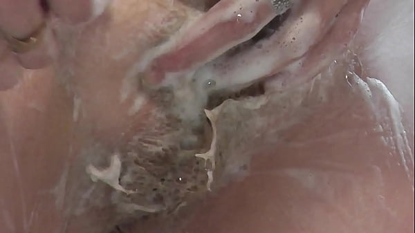 Shaving Cunt. Smooth Snatch. Unshaved Cunt. In Bathroom In Shower Fair-haired Sexy Cougar Frina Shaves Natural Bush. No Panties Under Dress. High Heels. Behind Cougar. All-natural