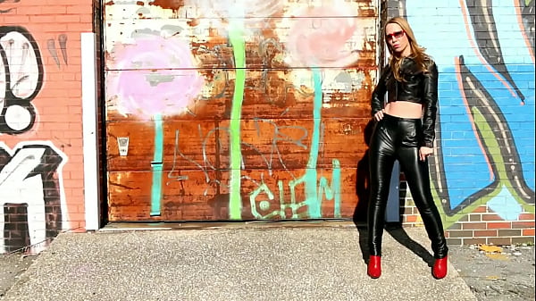 Blonde Posing In Black Leather Huffs, Leather Jacket And High Heels