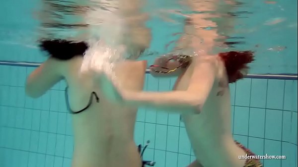 Mia And Petra Disrobe Eachother In The Swimmingpool