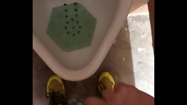 Male Pees In Urinal After Workout