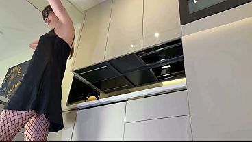 Sexy Tempting Long Stems Dark-haired Hotwife In Black And Red Fishnet Stockings With A Satin Nightie Flirts In The Kitchen