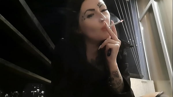 Dominatrix Nika Smokes Ravishing In The Evening On Her Balcony And Nurses Smoke In Your Face.