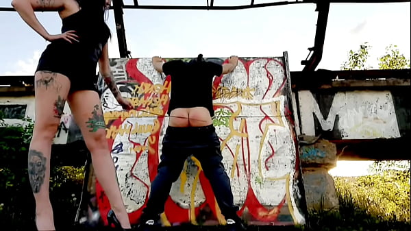 Punishment Of A Sub On The Street. The Dominatrix Took Off Heaves From The Servant And Beat His Buttocks With A Rod. How Loudly Her Weapons Whistle! Red Rump At The Sub.