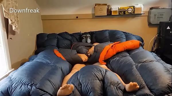 Grinding Oversized Orange Parka On Puffy Bed Of Down