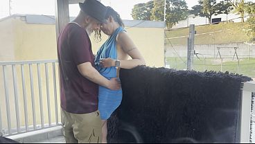 Outsiders Making Out On A Balcony During The Party.