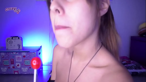 Cute Girl Tasting And Nursing A Lollipop