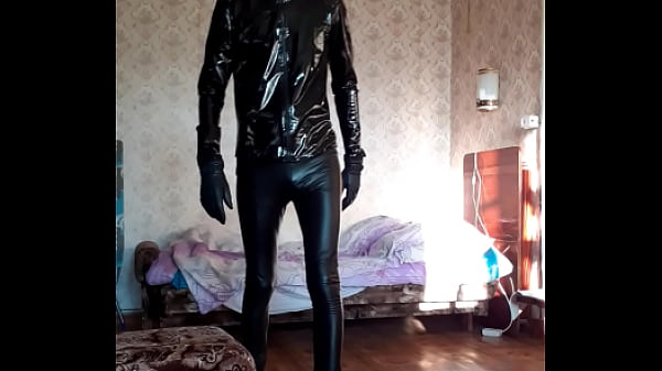 Dude In Leather Leggins And PVC Jacket