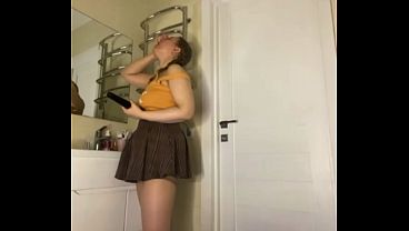 A Chubby Doll In A College Skirt Rams Herself
