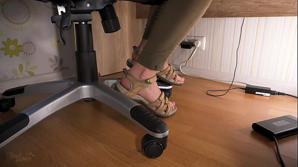 Cherish Her Tootsies In Worn Sandals Under Table