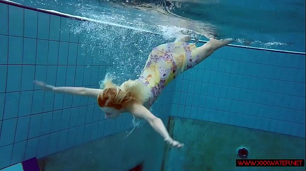 Light-haired In A Dress In A Pool
