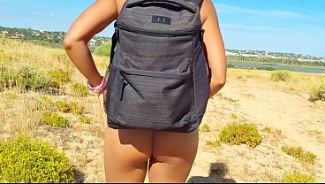 Couple Unwrapping Public Stroking Beach & Shops