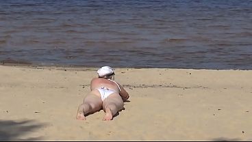 Nimble Older Mom Has Fun With Young Fellas On The Beach 2