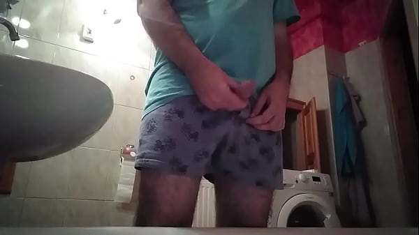 Mischievous Fella Pees In The Bathroom And Then Tugs His Uncut Prick!